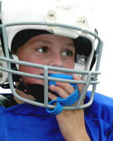 Head guard with attached mouth guard to minimise injury