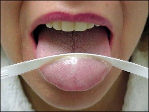 Use a tongue scraper